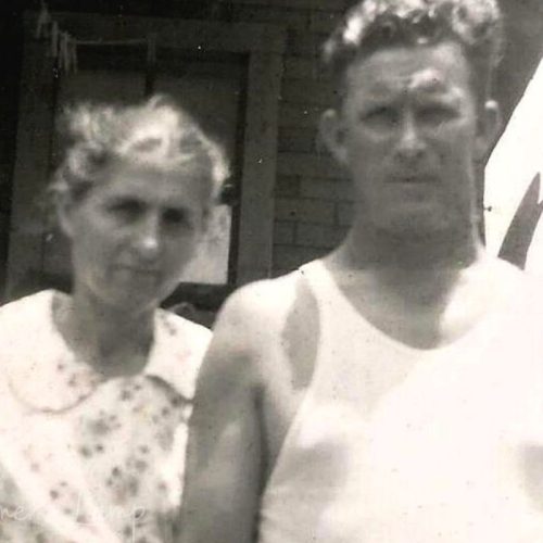 my grandparents as young married couple she is wearing a flour sack dress with a flower pattern on it and he is wearing a white sleeveless tshirt