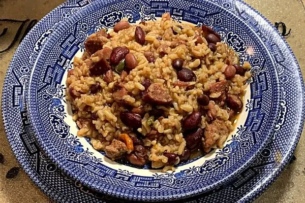 instant pot red beans and rice in a blue willow bowl