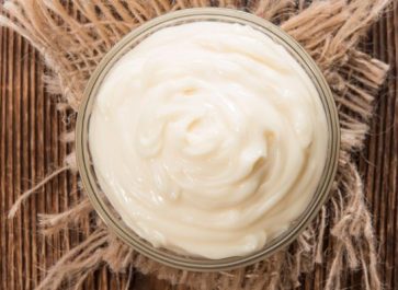 homemade mayonnaise in a clear glass bowl
