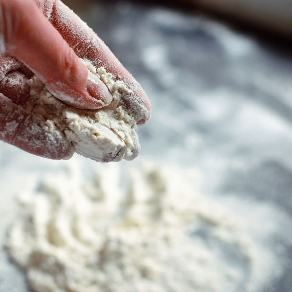 baking powder being added to flour