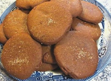old fashioned molasses cookies on a blue willow plate